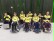 Das Bild zeigt ein Gruppenfoto unserer Mannschaft in gelben Trikots und im Rollstuhl sitzend.